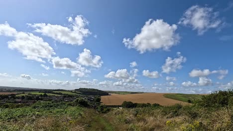 clouds drift over a picturesque countryside landscape