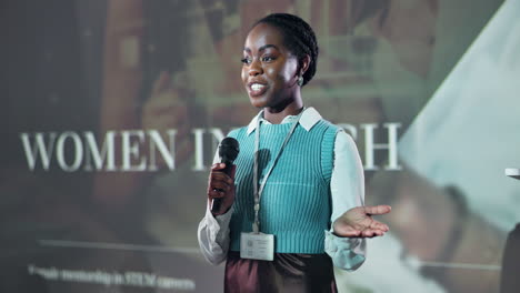 woman speaking at a conference