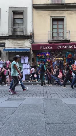 fast-paced timelapse of a busy afternoon on correo mayor street, mexico city. vertical shot