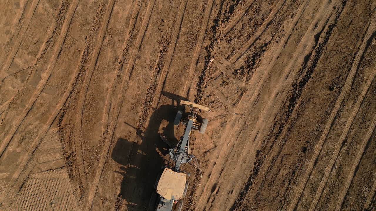 Aerial View of Land Grading Machinery in Action