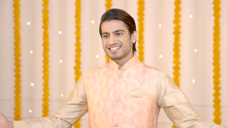 indian man wishing happy diwali in ethnic outfit