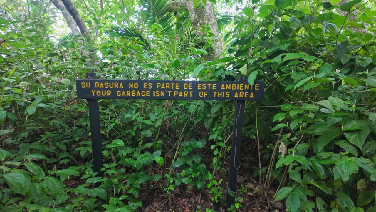 A sign calling for the cleanliness of nature with the message that your garbage isn't part of this area inside the Cahuita National Park in Costa Rica