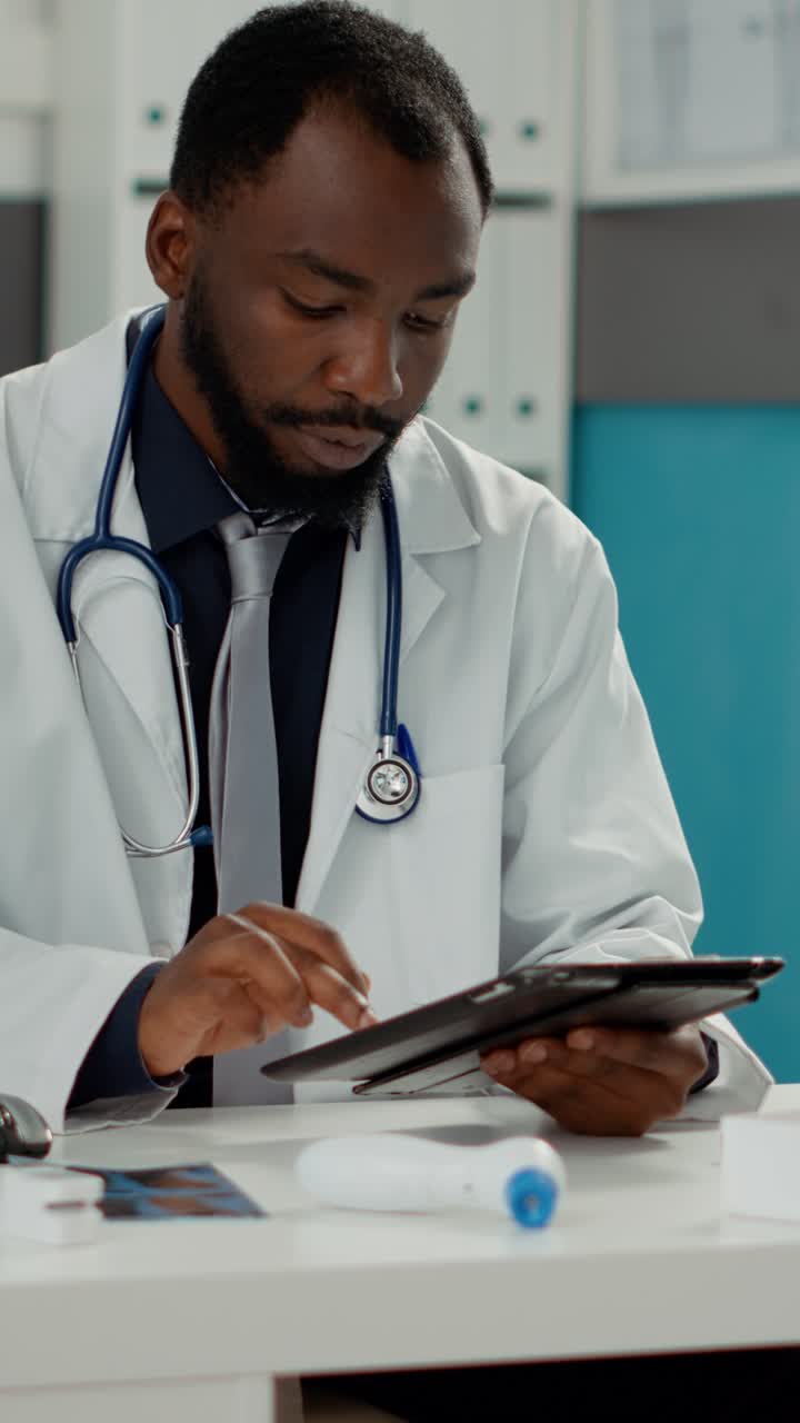 Doctor using a tablet in the office
