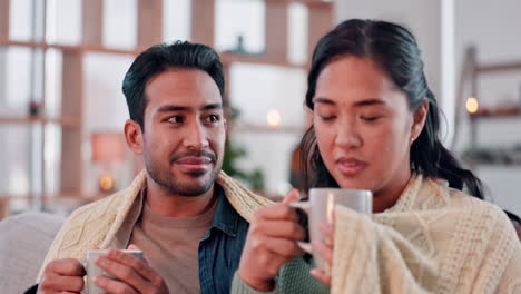 Coffee,-happy-and-couple-with-blanket-on-sofa