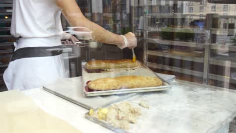 baker preparing strudel in a bakery