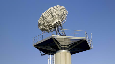 Close-up-view-of-a-white-satellite-dish-against-a-clear-blue-sky-in-Montpellier.