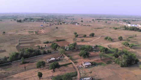 Aerial-shot-of-a-village-with-agricultural-fields-in-Chatra-in-Jharkhand-in-summer