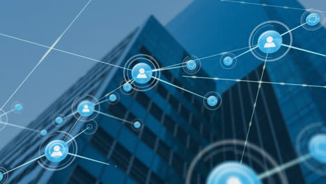 animation of network of digital icons against low angle view of tall building and blue sky