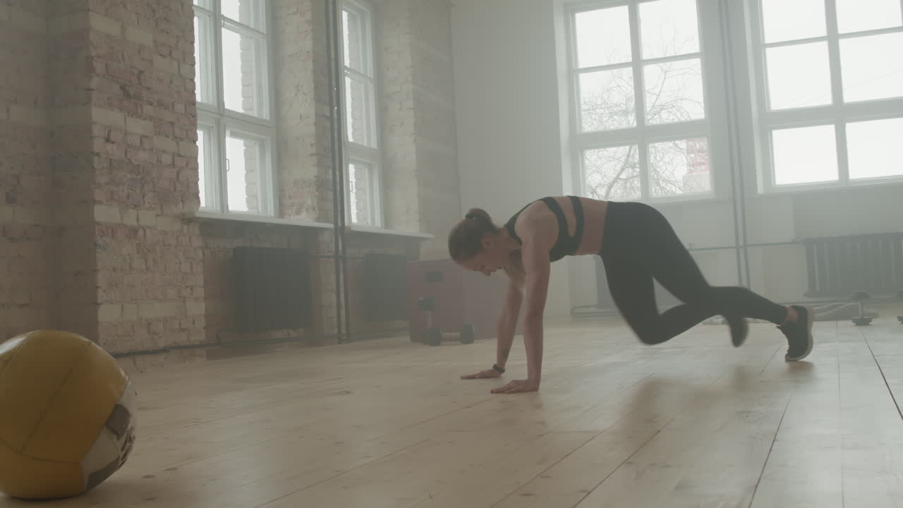 Sports Woman Doing Running Plank Exercise