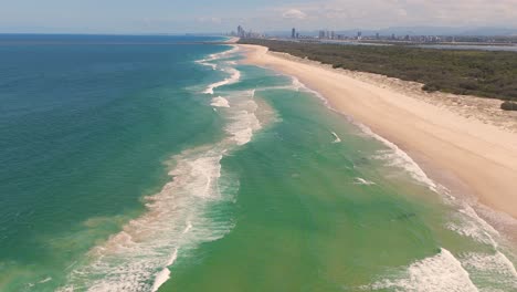 ocean waves and sandy beaches in brisbane