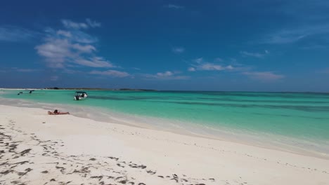 Escape-to-paradise-crystal-blue-waters-with-white-sand-beach,-pan-right-Los-Roques