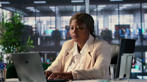 woman working on laptop in modern office