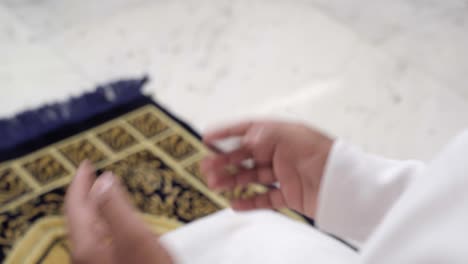 closeup of hands in namaz position