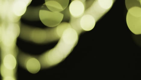 video de puntos de luz bokeh blancos y verdes parpadeantes con espacio de copia