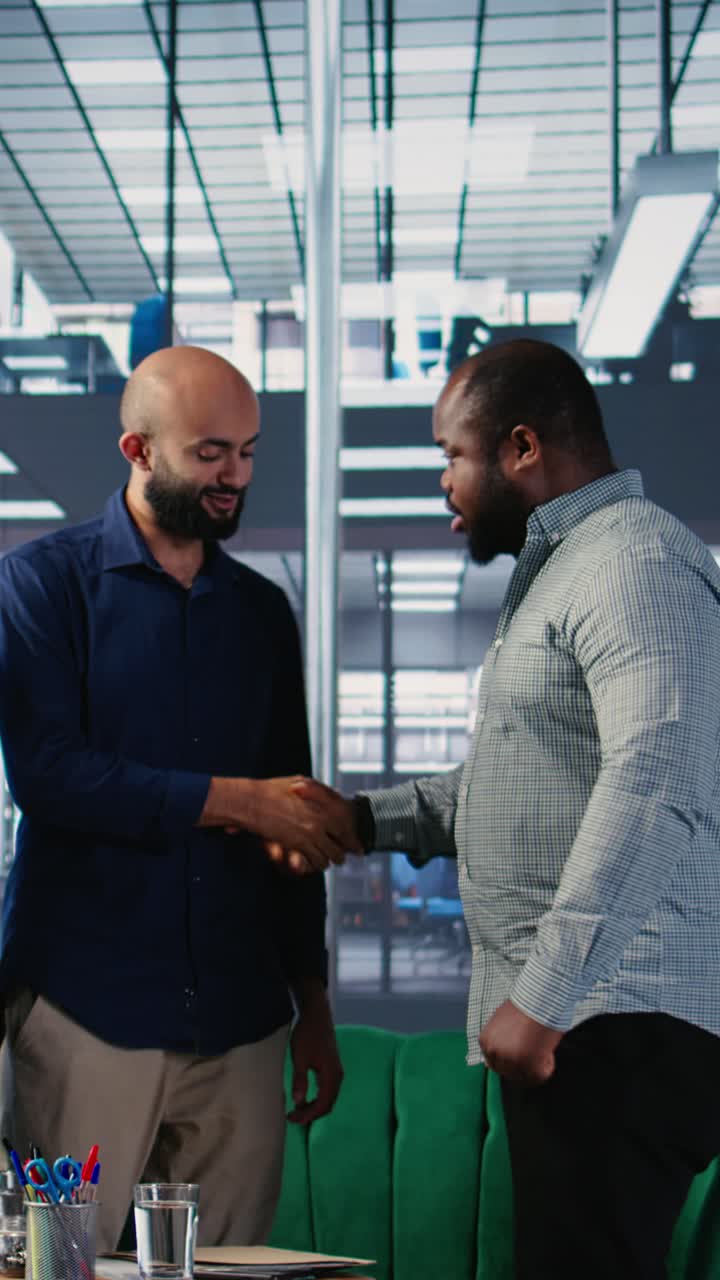Vertical Video Diverse business leaders greeting each other in a conference room