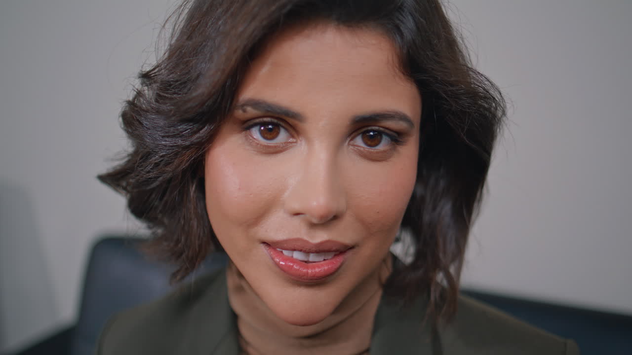 Portrait chic woman looking camera with confidence in office. Businesswoman