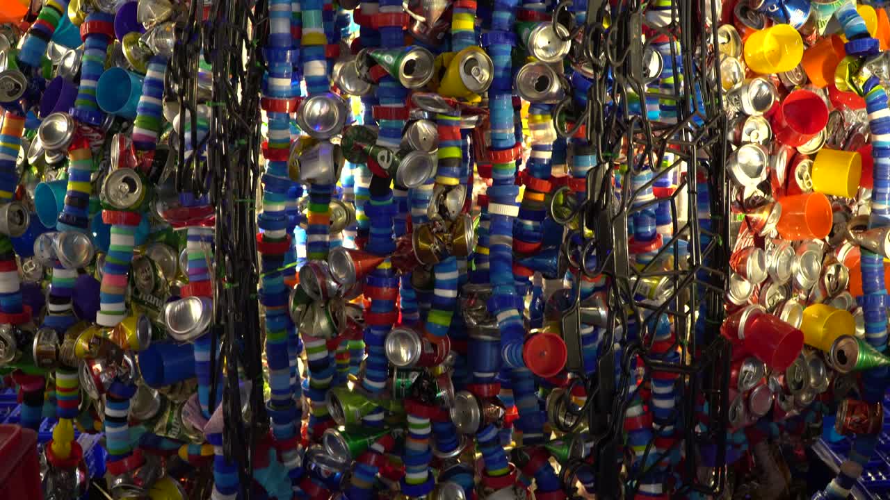 Plastic lids and beer cans to be decorated as arts and crafts.in Thailand