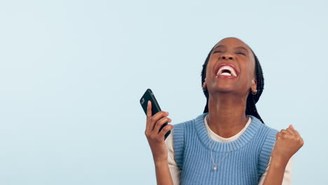 Happy-black-woman,-phone-and-fist-pump