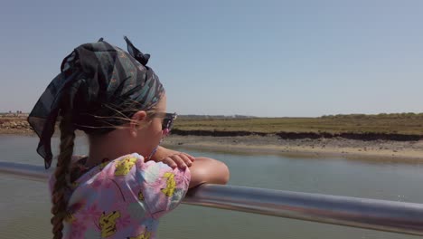 Lovely-Kid-On-A-Passenger-Ferry-Boat-Over-Gilao-River-In-Tavira,-Southern-Portugal