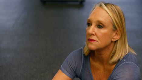 senior woman stretching in fitness studio 4k