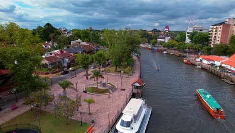 aerial view dolly in of catamarans and boats parked on the tigre river, tigre city, cloudy day