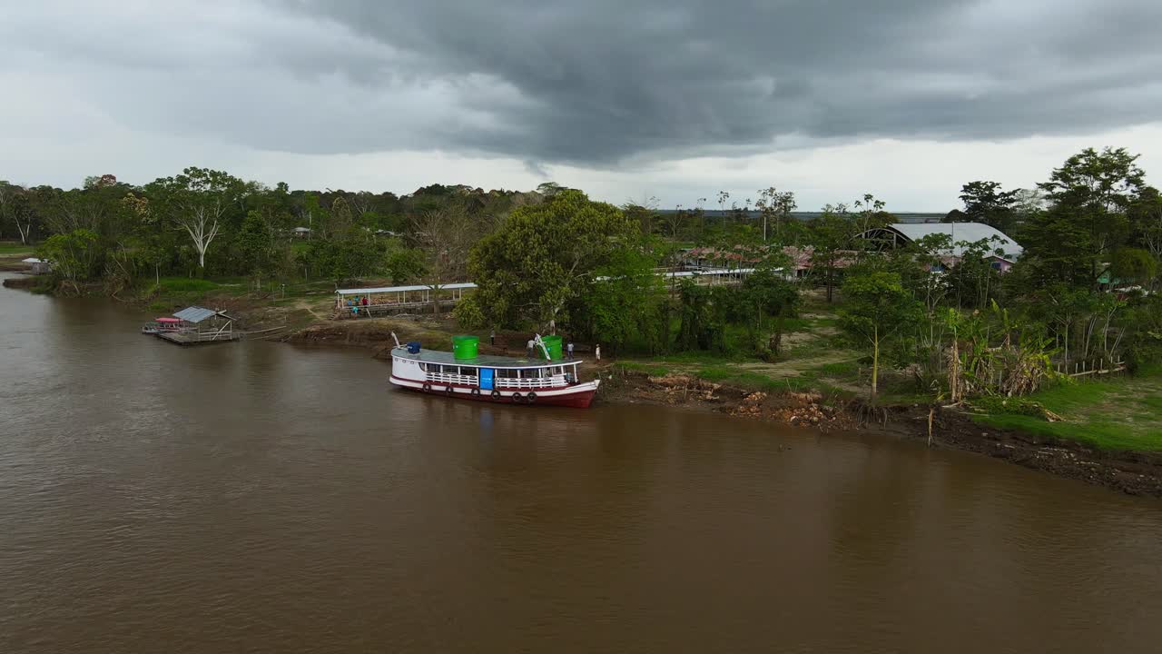 Drone Aerial fly at Manaus Brazil, Rain Forest Amazonian Landscape, Brown River, Ship docked at Port Coastline
