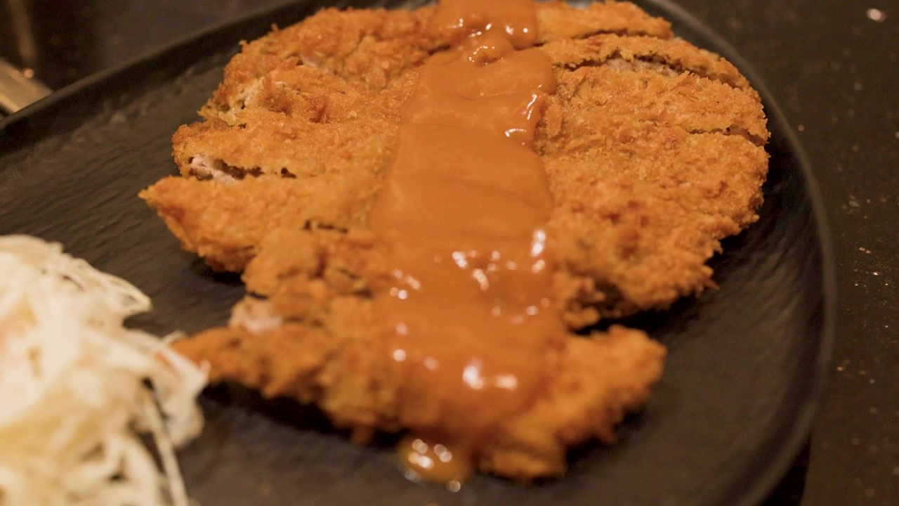Crispy Breaded Pork Cutlet Served with Shredded Cabbage