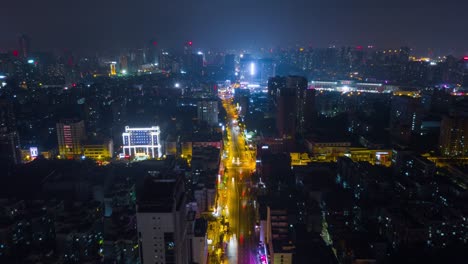 china night time illuminated wuhan cityscape traffic street aerial panorama 4k time lapse