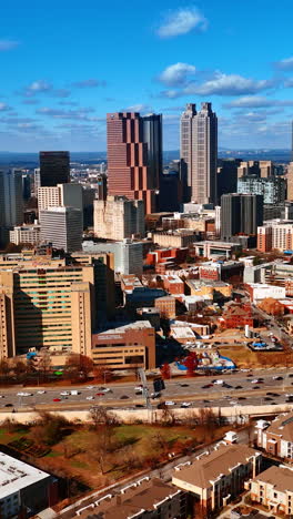 beautiful view of atlanta downtown with busy wide road going around. scenic view of the city from top. vertical video
