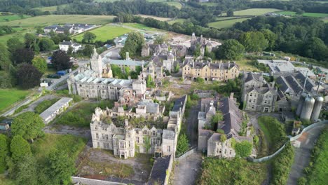 haunted denbigh lunatic asylum, north wales, aerial flyover northwest to southeast, sunny afternoon