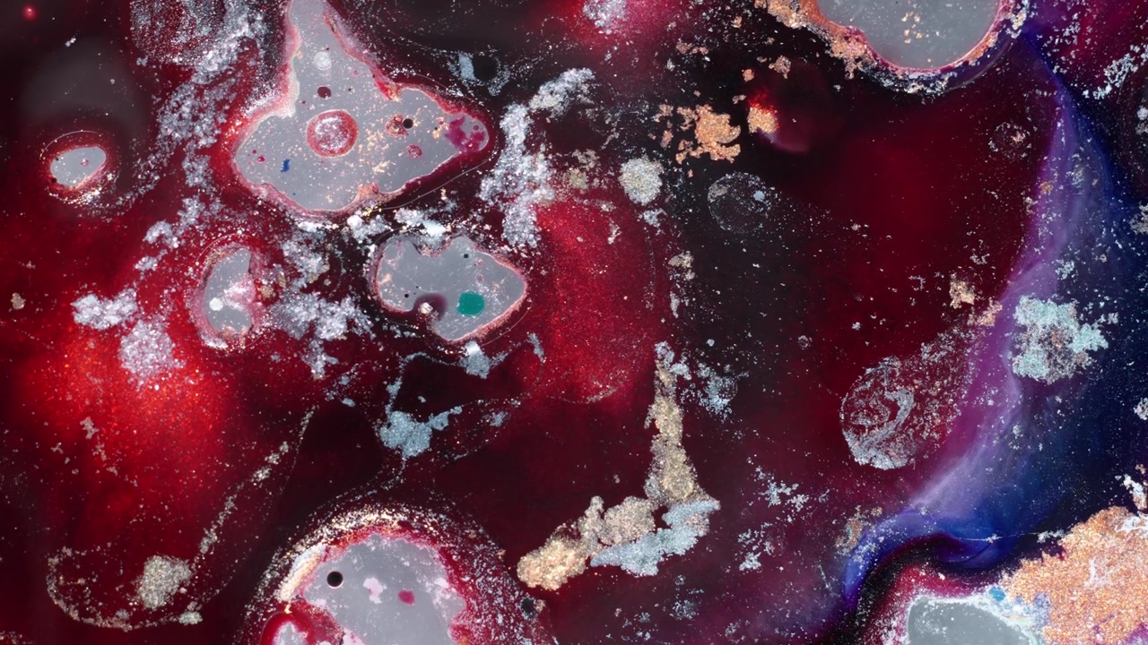 red and black alcohol ink merging into intricate fluid patterns. Moody cinematic atmosphere showing organic cells and bubbles evolving in a studio setting.