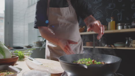 chef cooking stir-fry