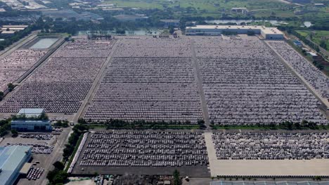 massive inventory of unsold cars parked at an open warehouse beside hyundai motors india manufacturing plant in chennai