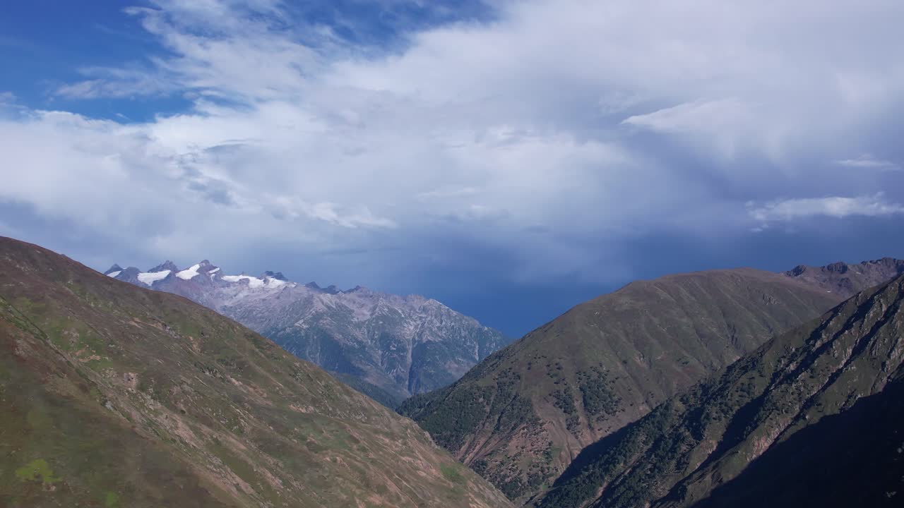 Kashmir’s towering mountain peaks and deep valleys under dramatic blue skies. Azad Kashmir