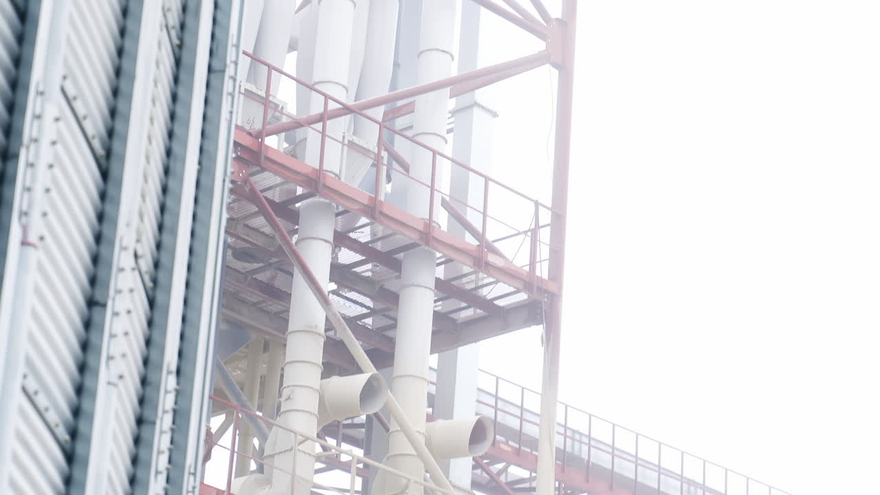 Close up view factory elevator construction. Industrial metal agricultural equipment.