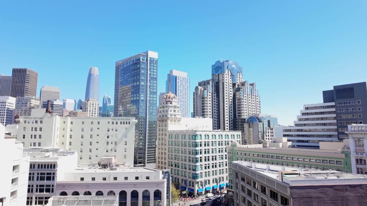 Rooftop view of downtown San Francisco highlights glass skyscrapers and city landmarks rising above the urban grid