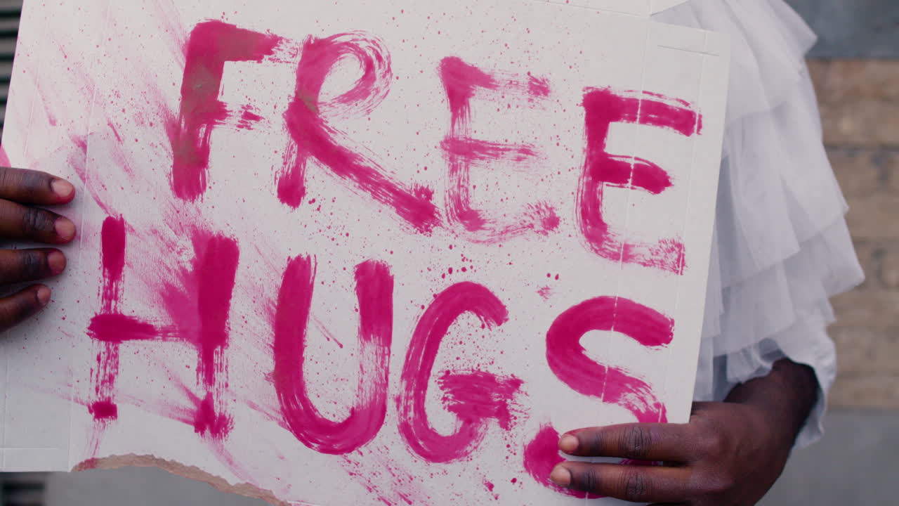 Clown holding banner