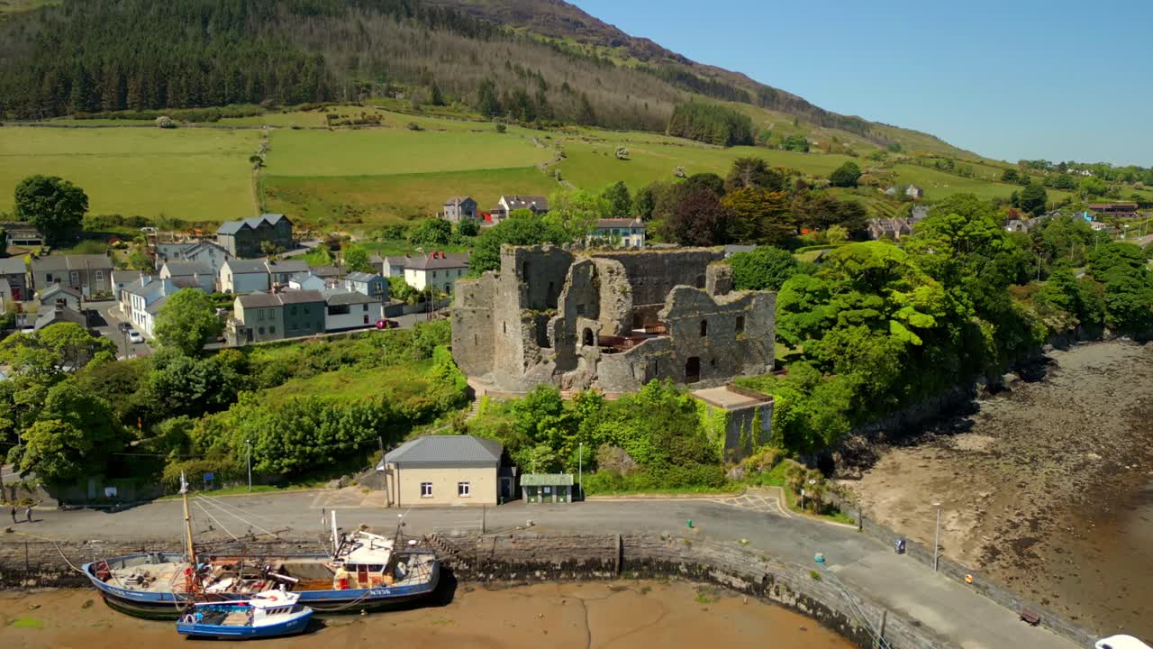 Tight to wide aerial video of Carlingford, County Louth, Ireland on a bright and sunny day. Filmed in 4K, 60FPS and with Rec709 color.