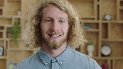 close-up-portrait-of-charming-geeky-hipster-man-smiling-cheerful-optimistic-young-businessman