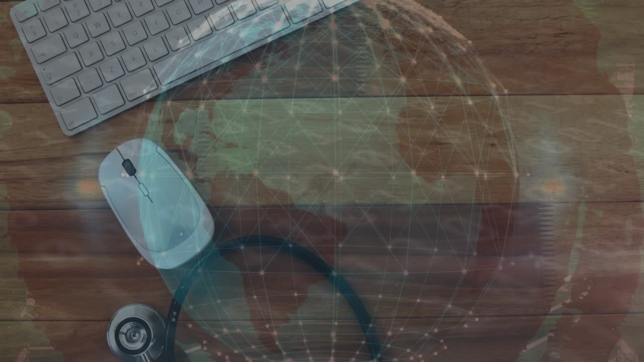Animation of digital globe over stethoscope, computer keyboard and mouse on table