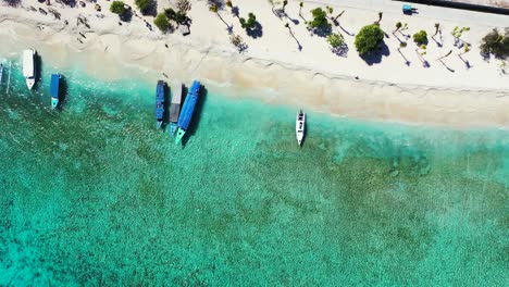 Sailboats-near-tropical-island-beach,-Bora-Borra,-French-Polynesia