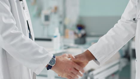 Doctors,-shaking-hands-and-partnership