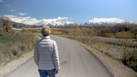 An-attractive-senior-woman-takes-a-nature-walk