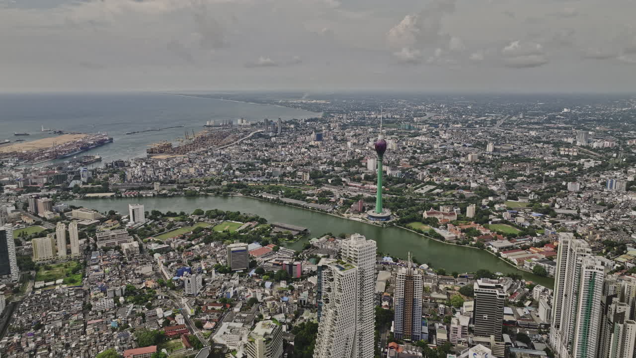 Colombo Sri Lanka Aerial v15 high altitude flyover area 02 and Wekanda capturing downtown cityscape of capital city from above featuring Lotus tower at Beira lake - Shot with Mavic 3 Cine - April 2023
