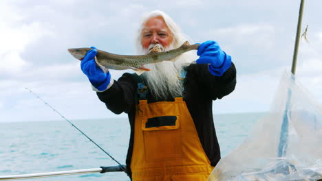 fisherman holding fish