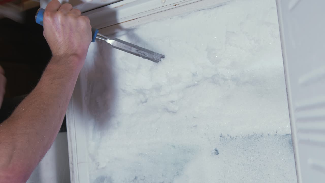 Chiseling ice from a completely blocked freezer