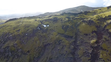 drone shot rising over iceland mountainside