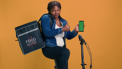 Woman-Grasping-Device-With-Green-Screen