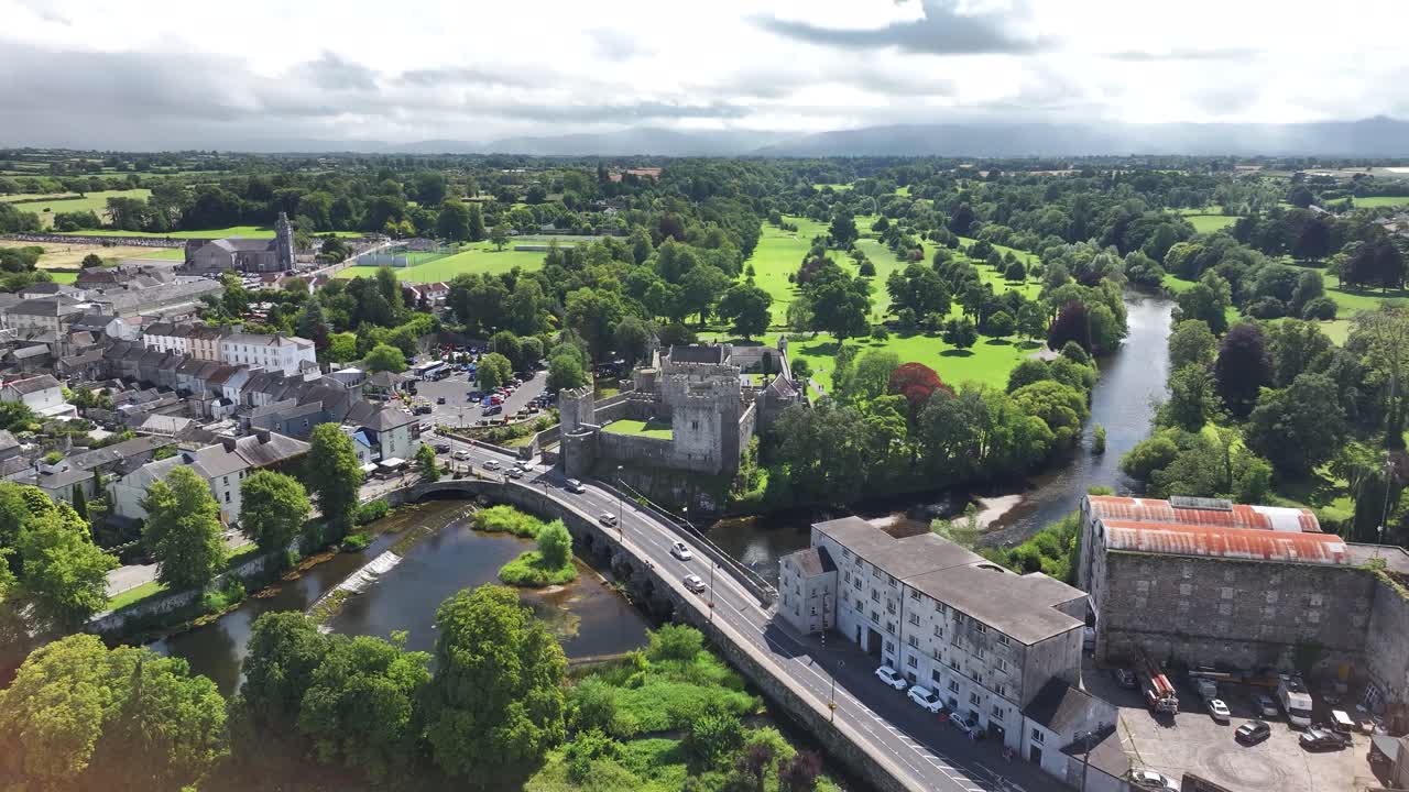 Cahir Town with Castle building on the river, rural background, Ireland. Aerial heritage, history