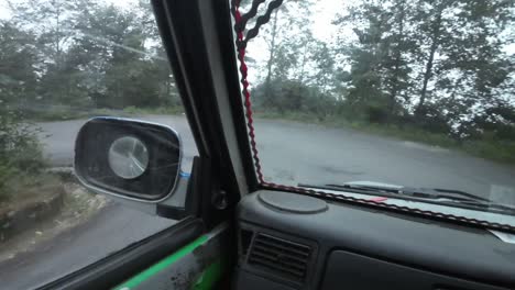 pov jeep ride through nepal's rugged interior. making a left turn on a windy mountain road
